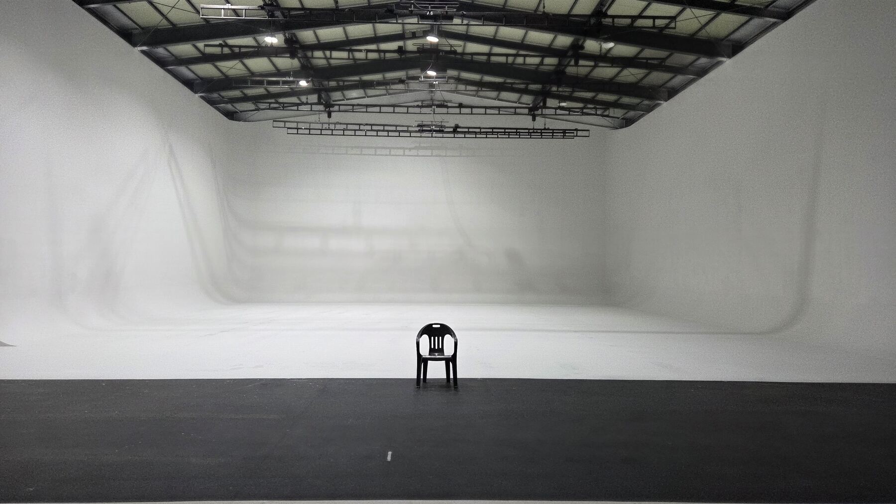 Empty white cyclorama stage at StageKnot studio