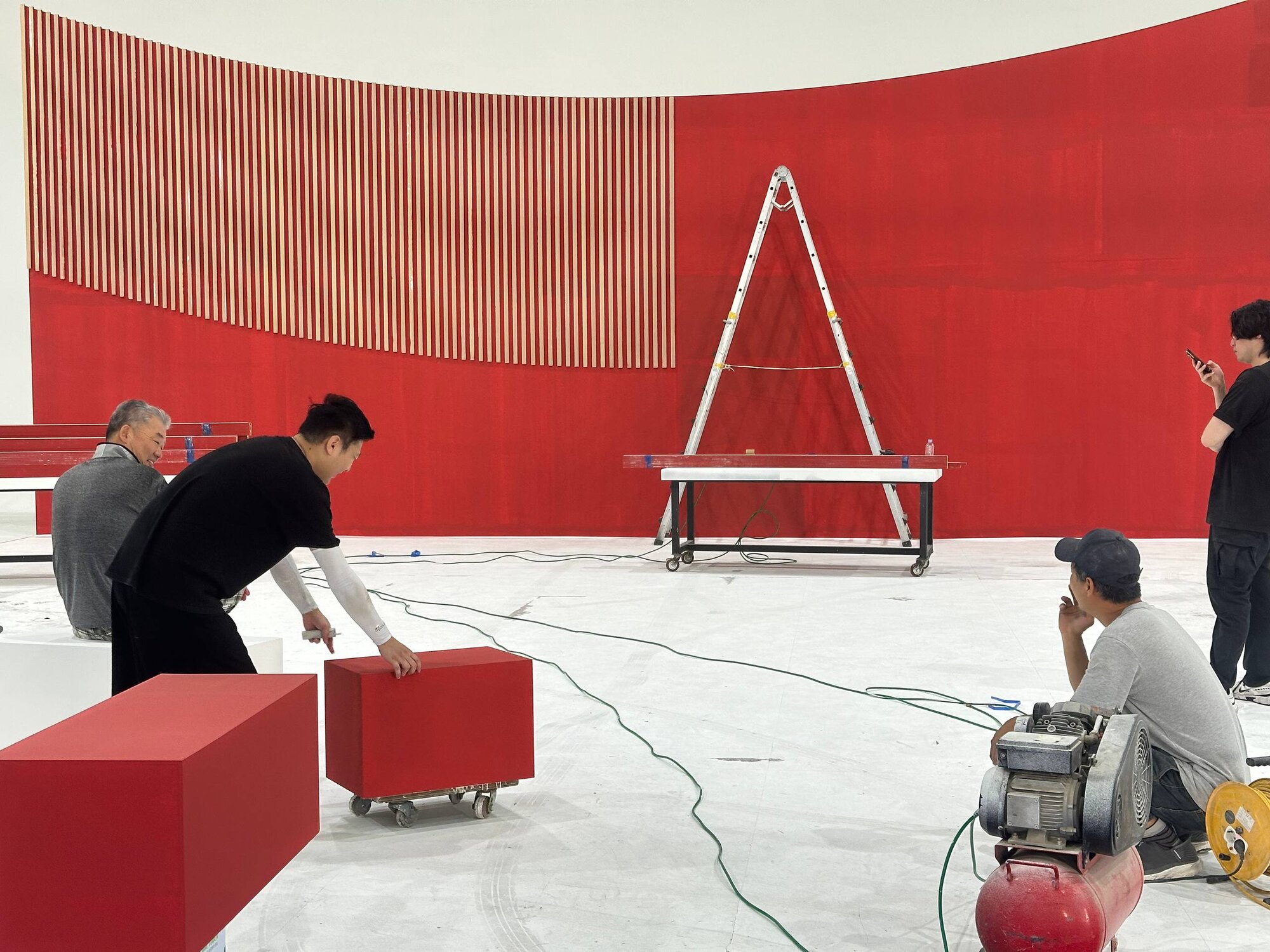 STAGECRAFT — StageKnot's in-house set design and fabrication brand, crew installing a curved wall